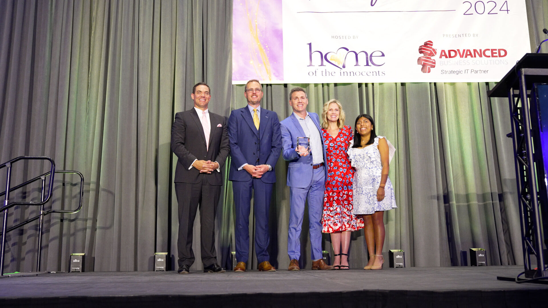 Jude Redfield accepts Home of the Innocents award